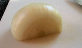half onion on cutting board
