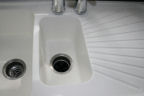 after picture of white kitchen sink with a coat of wax