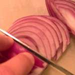 Greek Pasta Salad - slice onions into strips